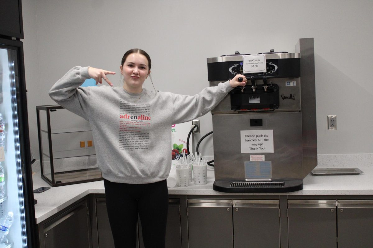 Sophomore Brooke Franzen serves ice cream in The Howl on January 27, 2024. She is volunteering for the Northern Lights competition.