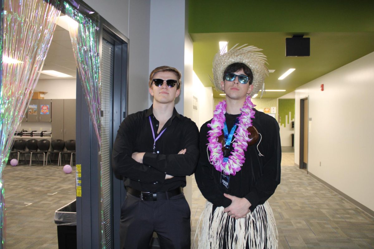 Sophomores Ronan Clements and Barrett Haun prepare for the middle school groups to arrive. They are the hosts of the Northern Lights competition on January 27, 2024.