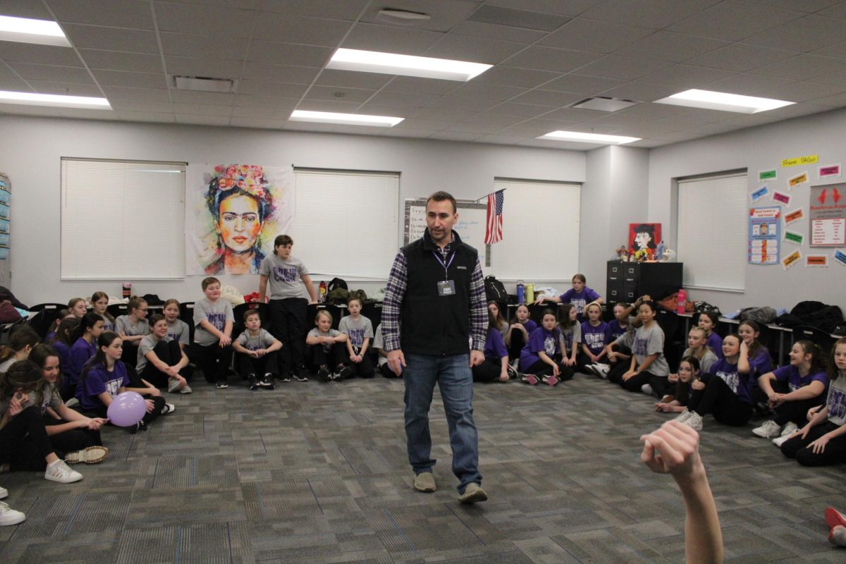 Middle school choir director Eric Engstrom talks to his group before the performance. This 6th-grade group performed during the first session of the Northern Lights competition.