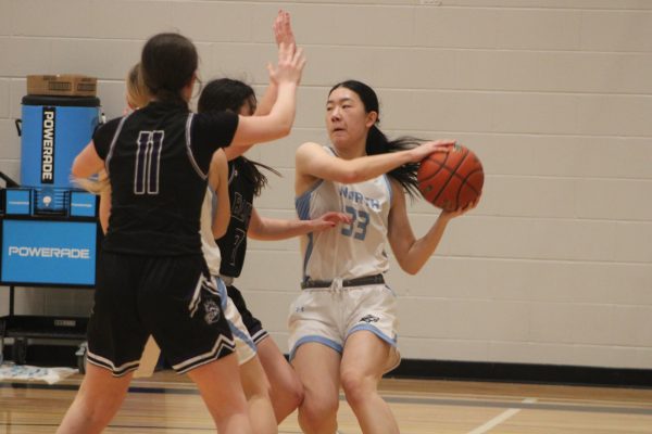 Sophomore Erica Zhang (33) avoided getting the ball stolen by the opposing team. She played on Thursday January 25th, 2024.