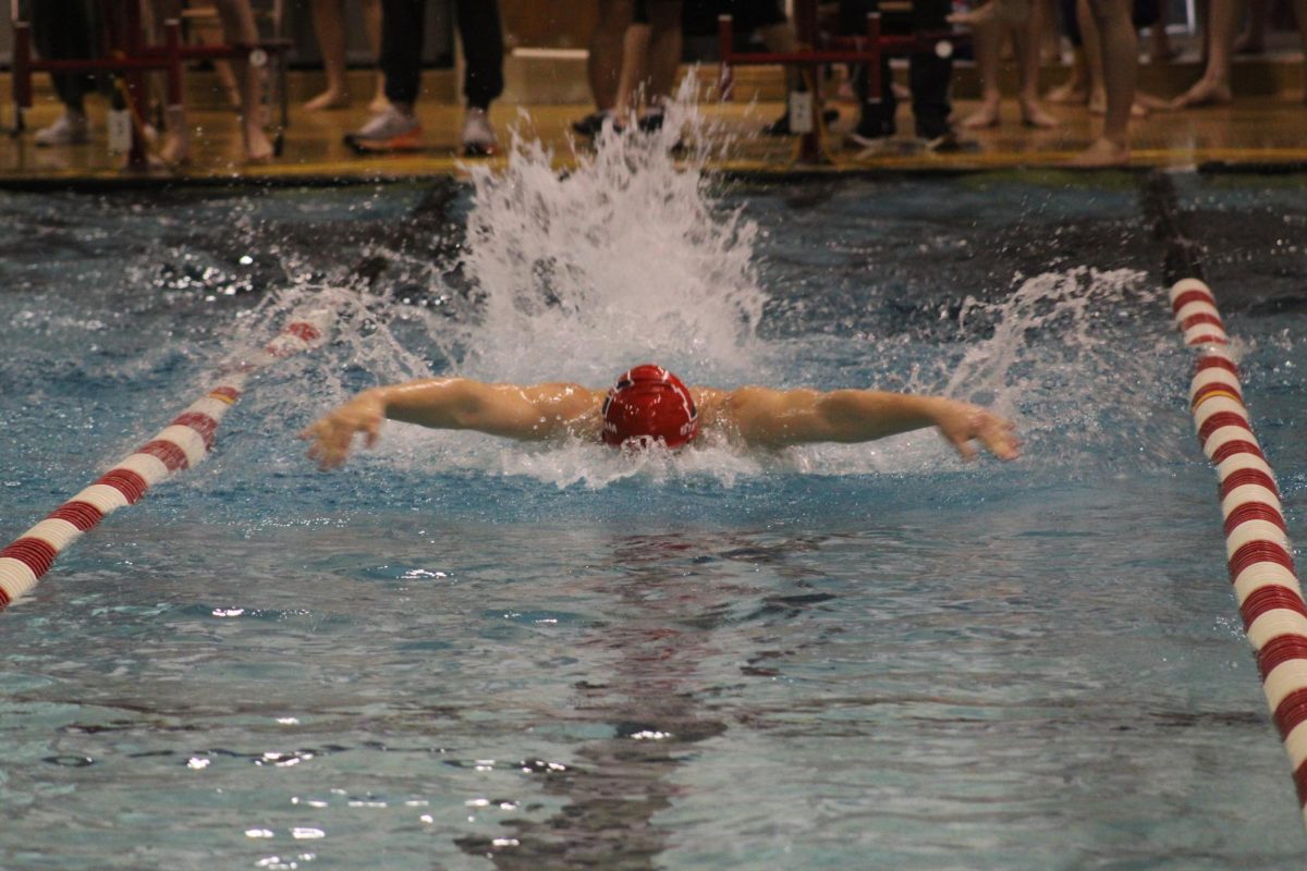 Senior+Dylan+Palmer+swims+the+100+yard+butterfly+on+January+27%2C+2024.+Palmers+time+was+58.66+seconds.+%0A