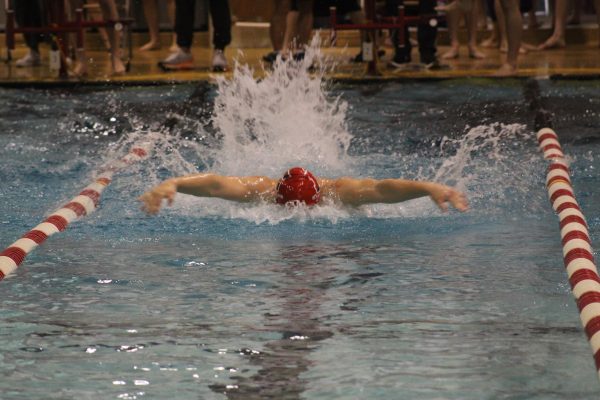Senior Dylan Palmer swimming boys 100 Fly on January 27, 2024. Palmer 58.66 as his final time.
