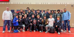 The boys wrestling team celebrating together after a long day of matches on the mat. The team won the Platteview High School Invitational tournament on Dec 15, 2023.