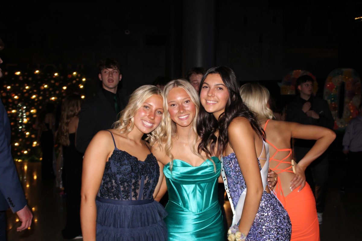 Seniors Addy Maxell, Madi Harrison, and Jada Mack pose for a picture at prom on April 13, 2024. The three have been friends for a while and had fun together throughout the night. 
