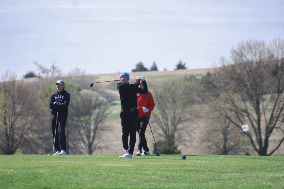 Cole Dryak (12)  hits his drive on hole number 8 at River Wilds on April 19, 2024. His shot lands in the fairway, successfully avoiding the water hazard.