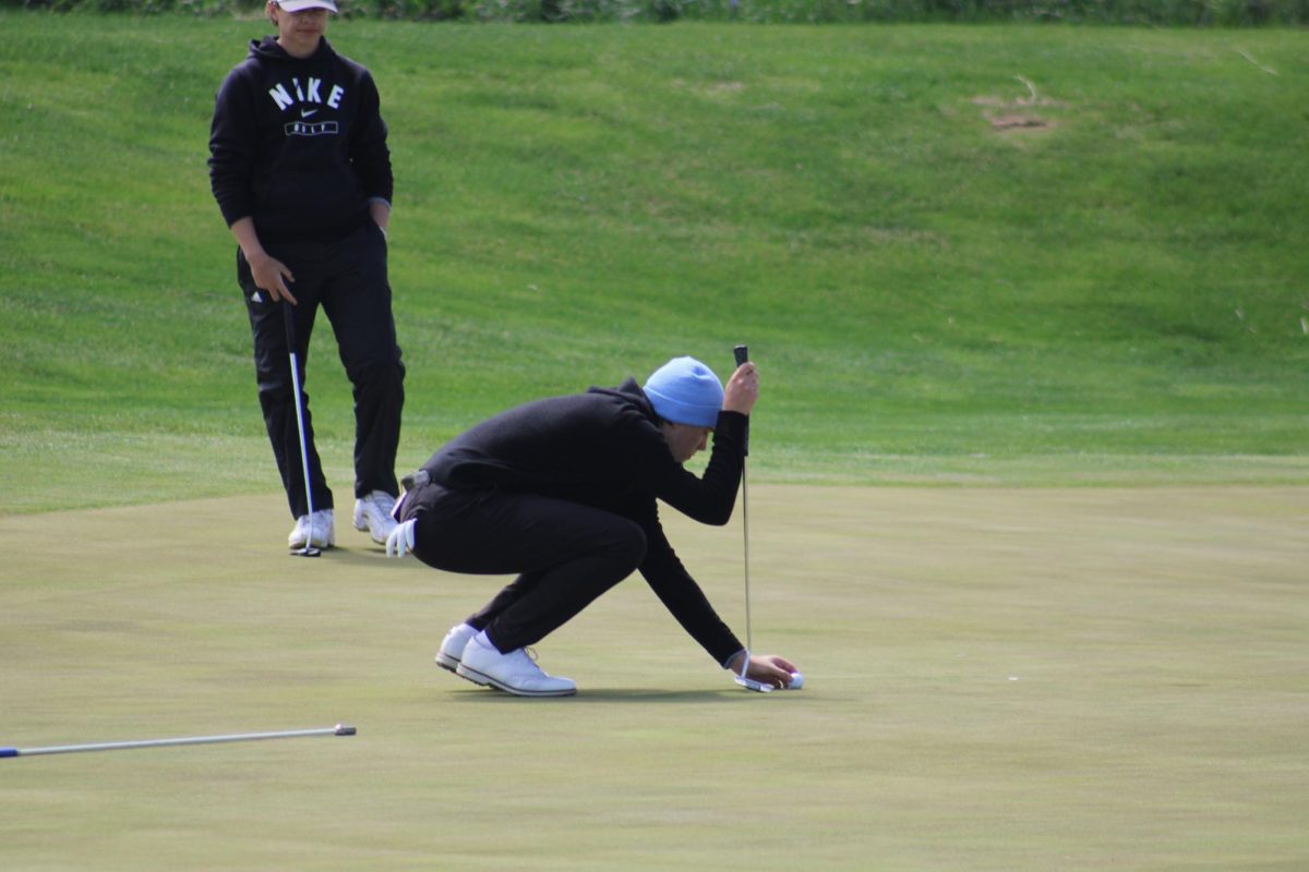 Cole Dryak (12) lines up his putt for par on the 16th hole at River Wilds on April 19, 2024. He makes the putt and continues on with his round.