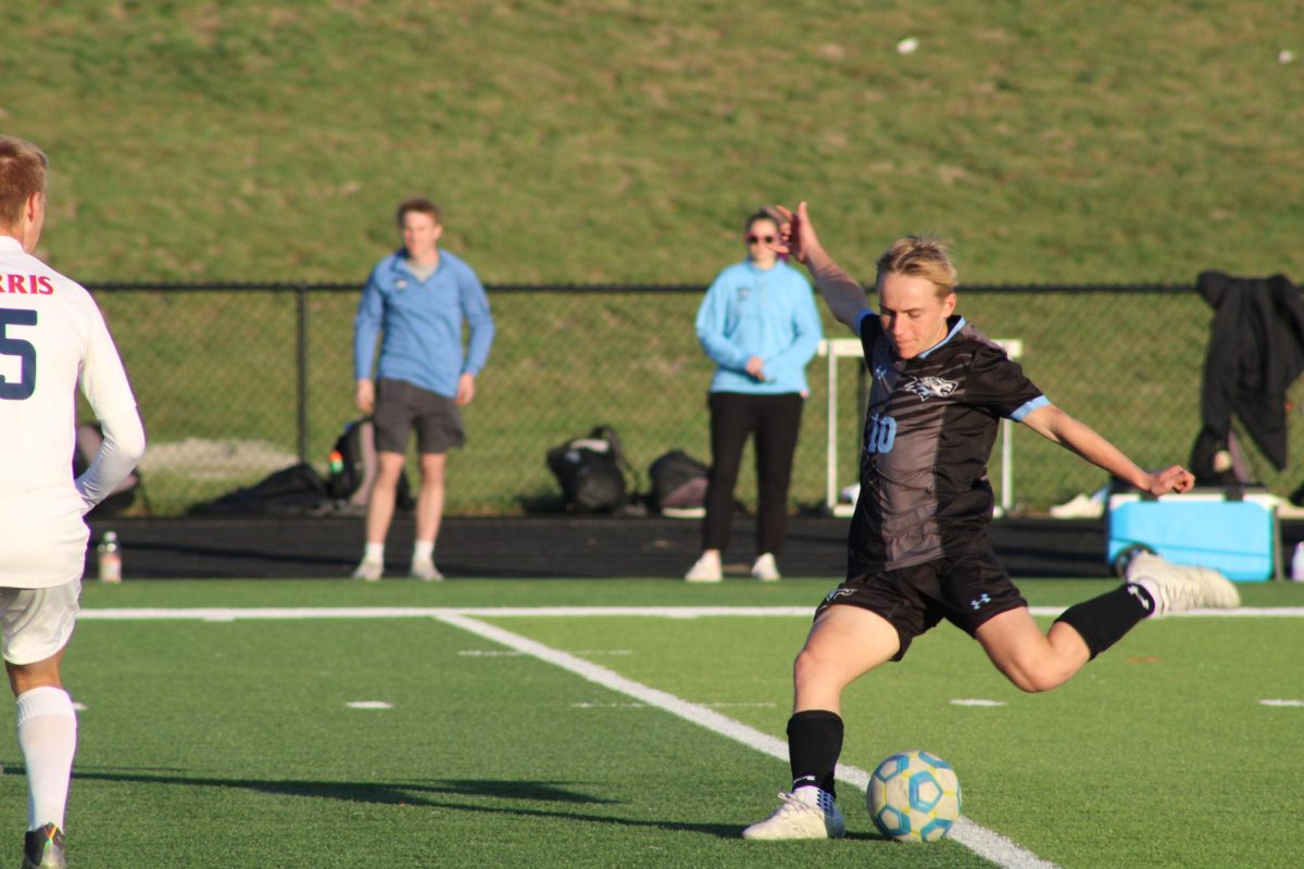 Sophomore Jack Olson (10) kicking the ball in the first half of the game. Olson got a lot of playtime and contributed heavily to the Wolves' win on Tuesday, April 23rd.