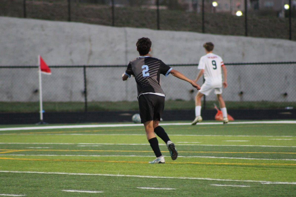 Sophomore Derek Rieck-Capellan (2) running to get a better position on the ball. He swings Junior Varsity and Varsity, having played in the second half of the game on Tuesday, April 23rd and scored a goal later on.