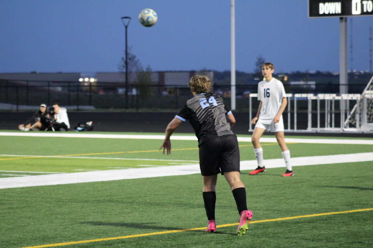 Sophomore Harrison Vokt (24) performing a throw in. Vokt was able to play for Varsity at the game on Tuesday, April 23rd.