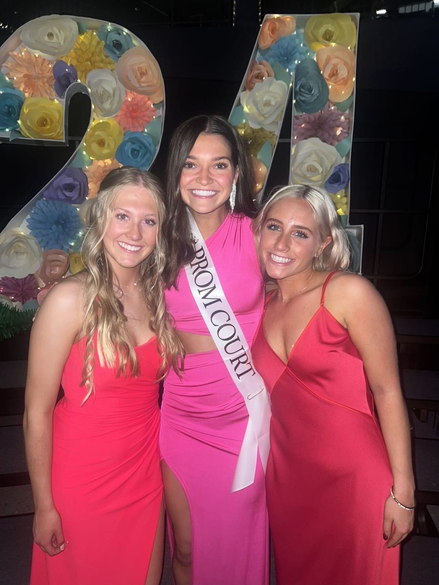 Junior Sydney Wallace, senior Ava Spies, and junior Payton Brummels pose together at prom. Spies and Brummels both had their colors done and selected dresses in their pink palette. 
Photo courtesy of Payton Brummels.