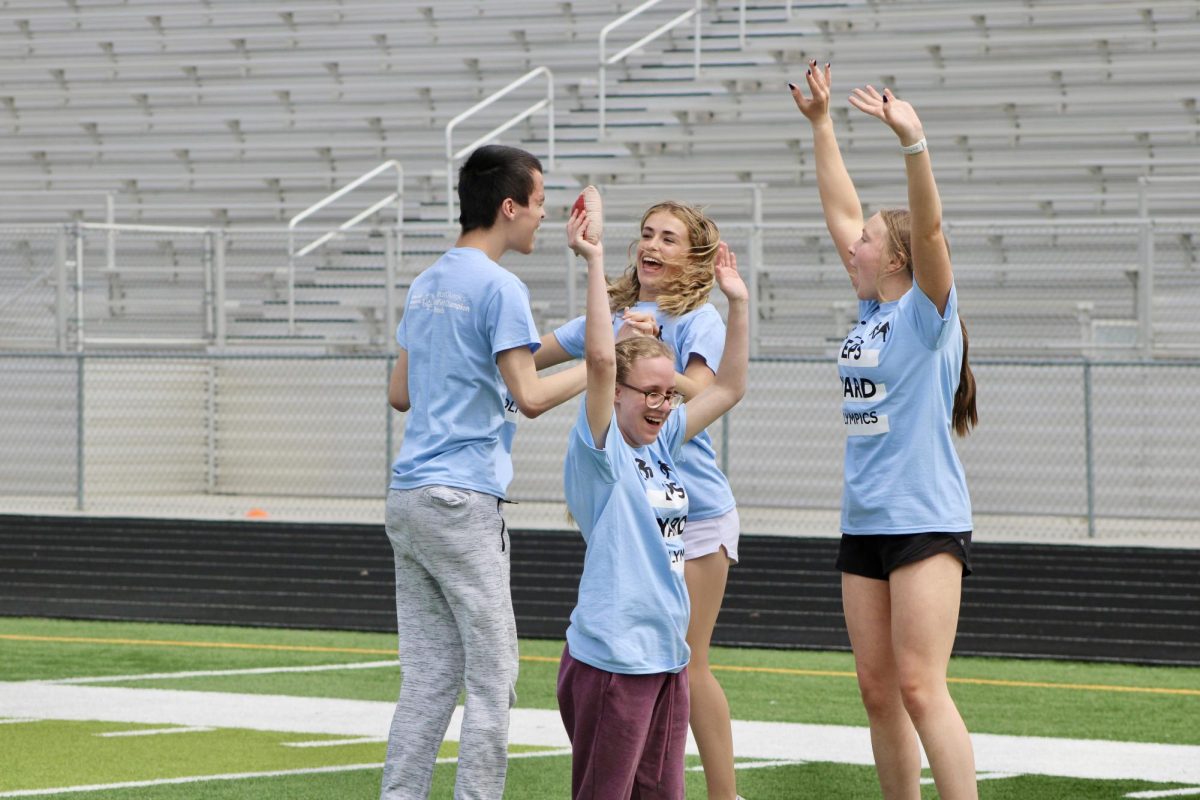  Junior Nathan Humphreys, Junior Lexi Wright, Sophomore Lily Doscher, Sophomore Charoltte Kenny celebrating. The Wolves were in first place after the third event on May 3, 2024. 