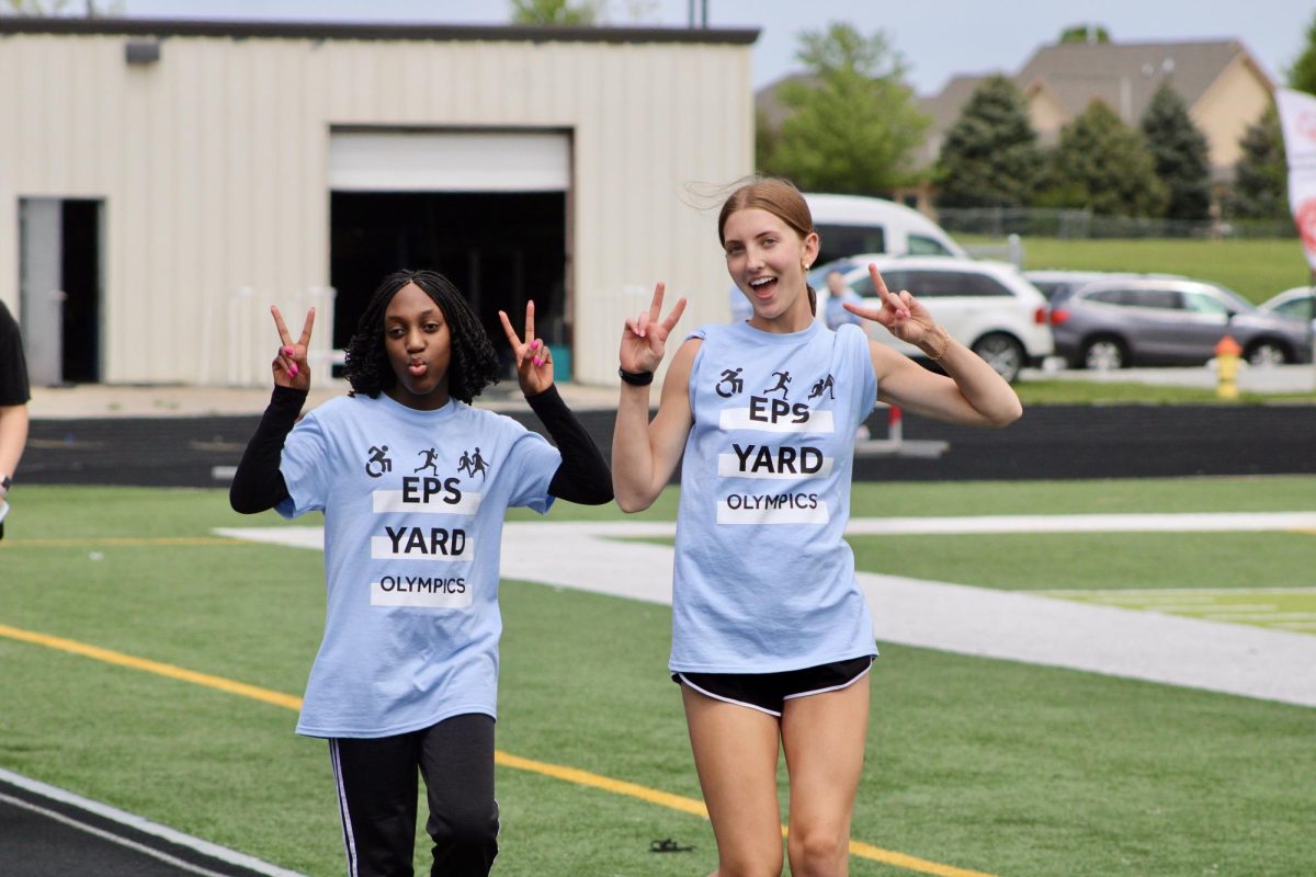  Freshman Nella Lodonou (left) and Sophomore Hayden Booth  (right) pose as they walk around the track. They walk multiple laps around the track to get as many points from the Wolves as possible on May 3, 2024.
