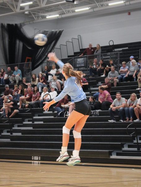 Junior Hayden Booth (6) jump serves. This started a good rally, which the Wolves won. Photo by Niharika Kandari.