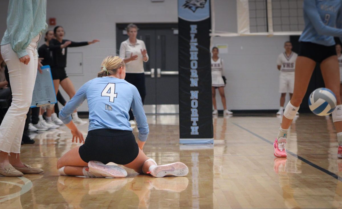 Senior Shay Heaney recovers from her dive for the kill. She wasn’t able to make it to the ball, and Waverly called the ball in.
