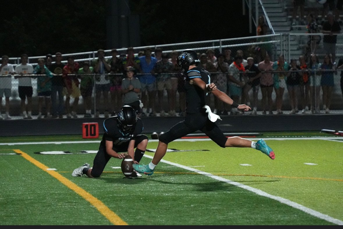 Senior Jackson Crom kicks a field goal at a varsity football game on Friday August 30th. The wolves beat Lincoln Pius X  24-21. Photo courtesy of Renee Vokt.