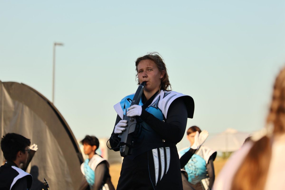 Senior Ava Kloster plays the Alto Sax during her solo. She played the aero bone, an electrical saxophone. Photo courtesy of PLV Media