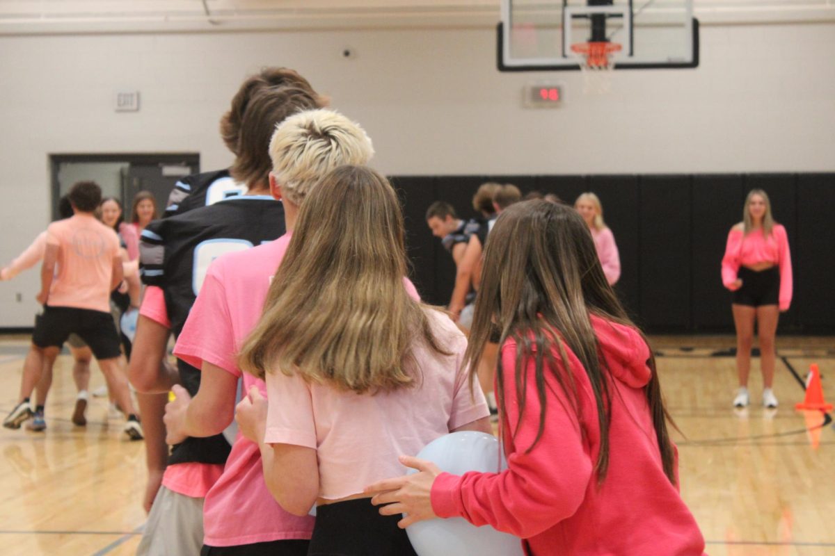 Sophmores [left to right] Koda Mielak, Sam Franco, Ava Fanoele, and Avery Spethman rush to the finish line during the snake game. Spethman touches the balloon which is against the rules. Instructors miss this and sophmores leave with a win in the snake game. 