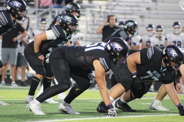 This is senior captain, AJ Paladino (#51) right before the snap.