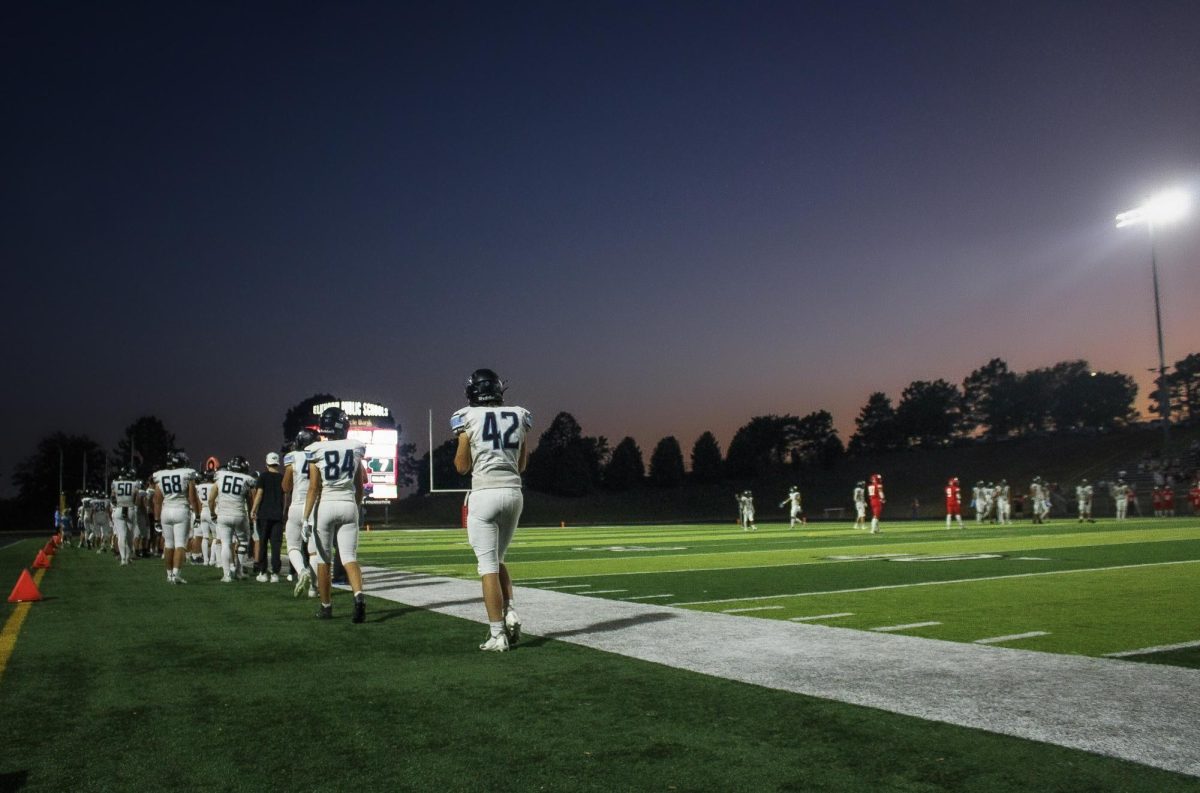 Sophomore Aspen Boehler (42) trails behind the team on the sidelines. The Wolves realized that this could be their first loss of the season.