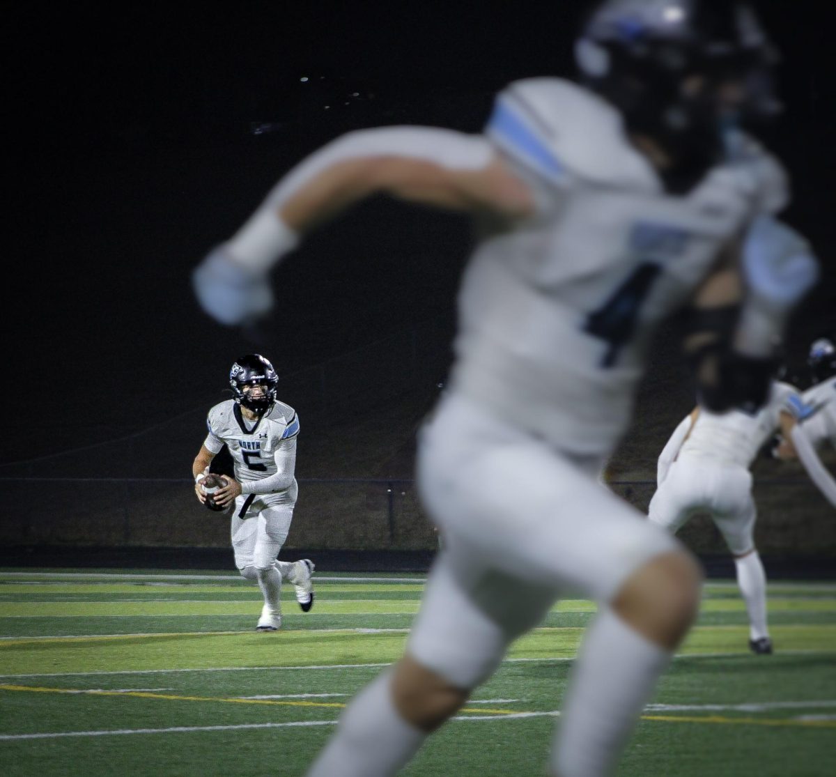 Junior Ethan Beachy (5) prepares to make a pass. Beachy is the Wolves starting quarterback.