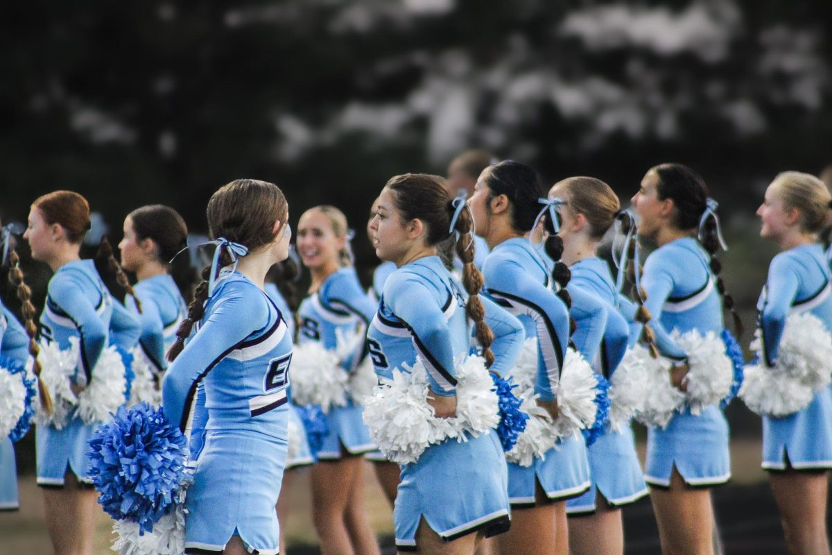 Sophomore Catelynn Gaboury looks to see the rest of the Elkhorn North cheerleaders turned around. 