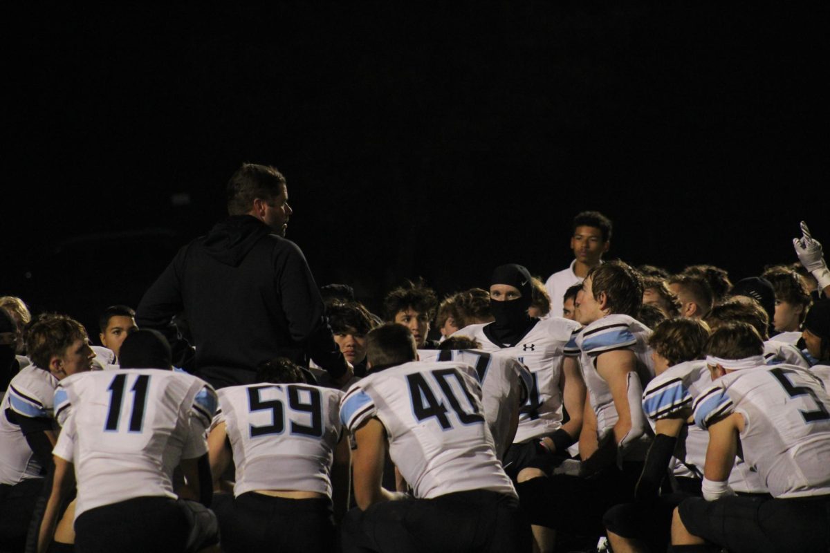 The Wolves gather in a huddle after the game to reflect on their performance. Stanley led the huddle by praising his players and talking about motivation for the next week.