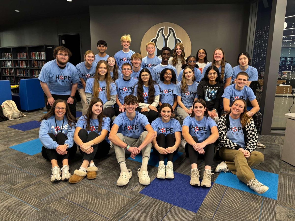 The 2024 Hope Squad group posed for a picture in the ENHS library. They are a young group of encouraging individualds who help out all people, no matter their circumstances.