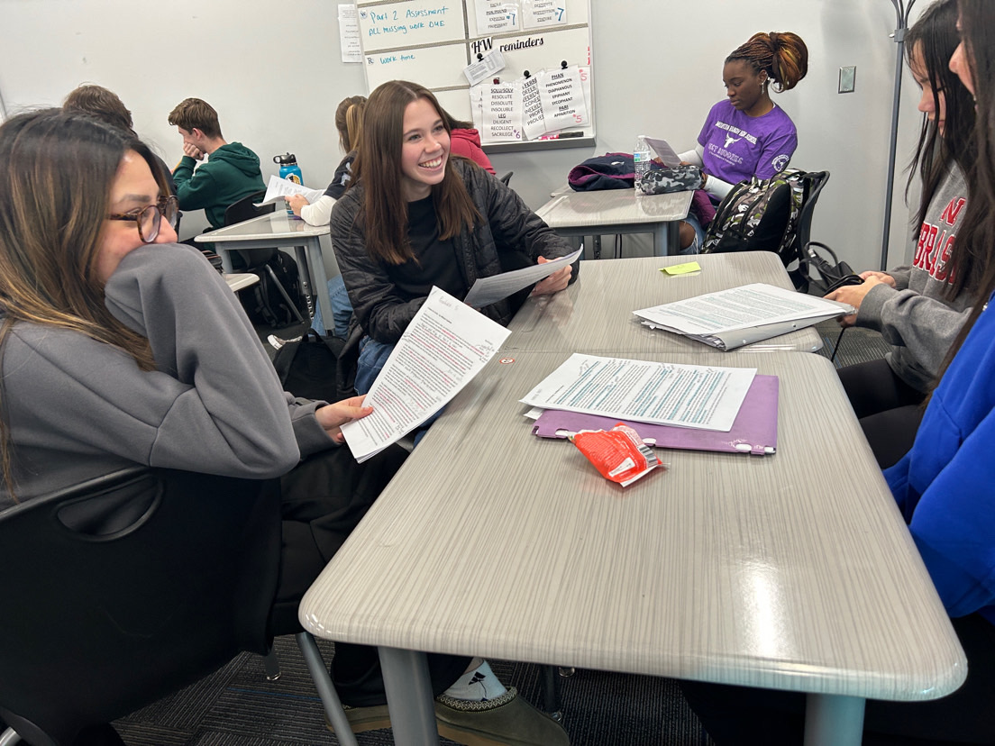 Senior Mia Speranza works with her classmates on an AP Literature assignment. 