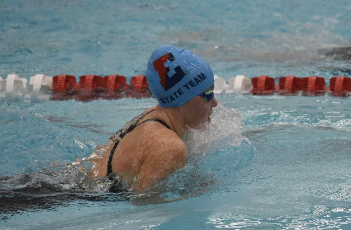 Makenzie Peter swims at a meet completing a breaststroke. She finished fifth in the 100 meter breaststroke. 