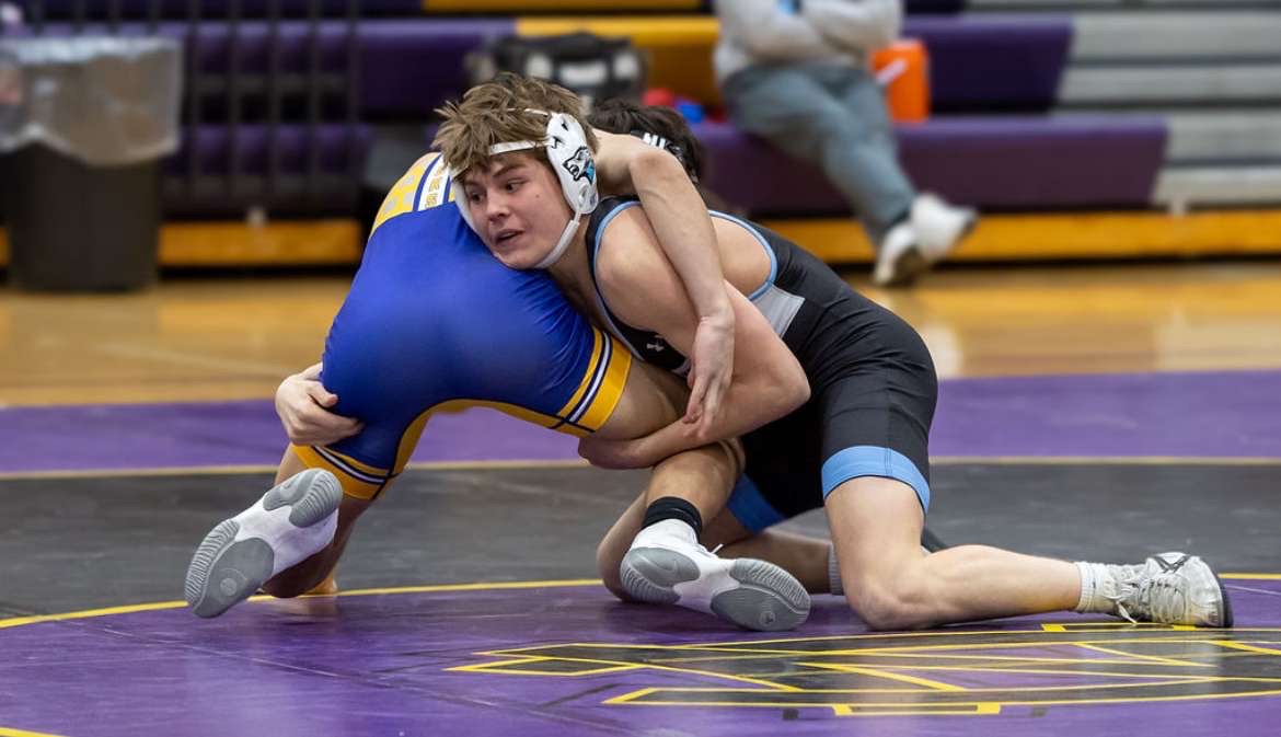 Junior rrestler James Ferguson shooting for a takedown at Nebraska City. Photo Courtesy of Nate Trofholz