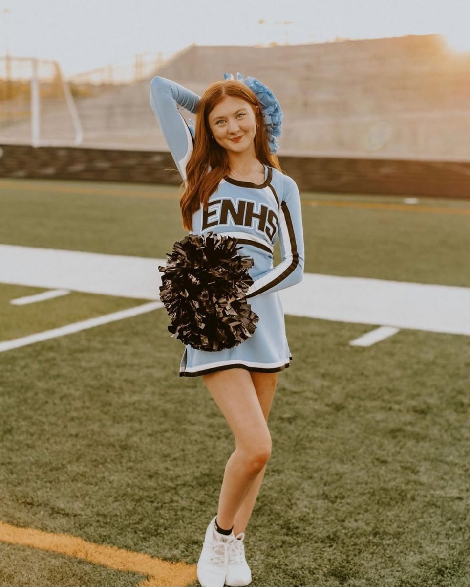 Senior Emma Carter poses for her last media day as an Elkhorn North cheerleader.  She is a captain of the varsity cheerleading team.