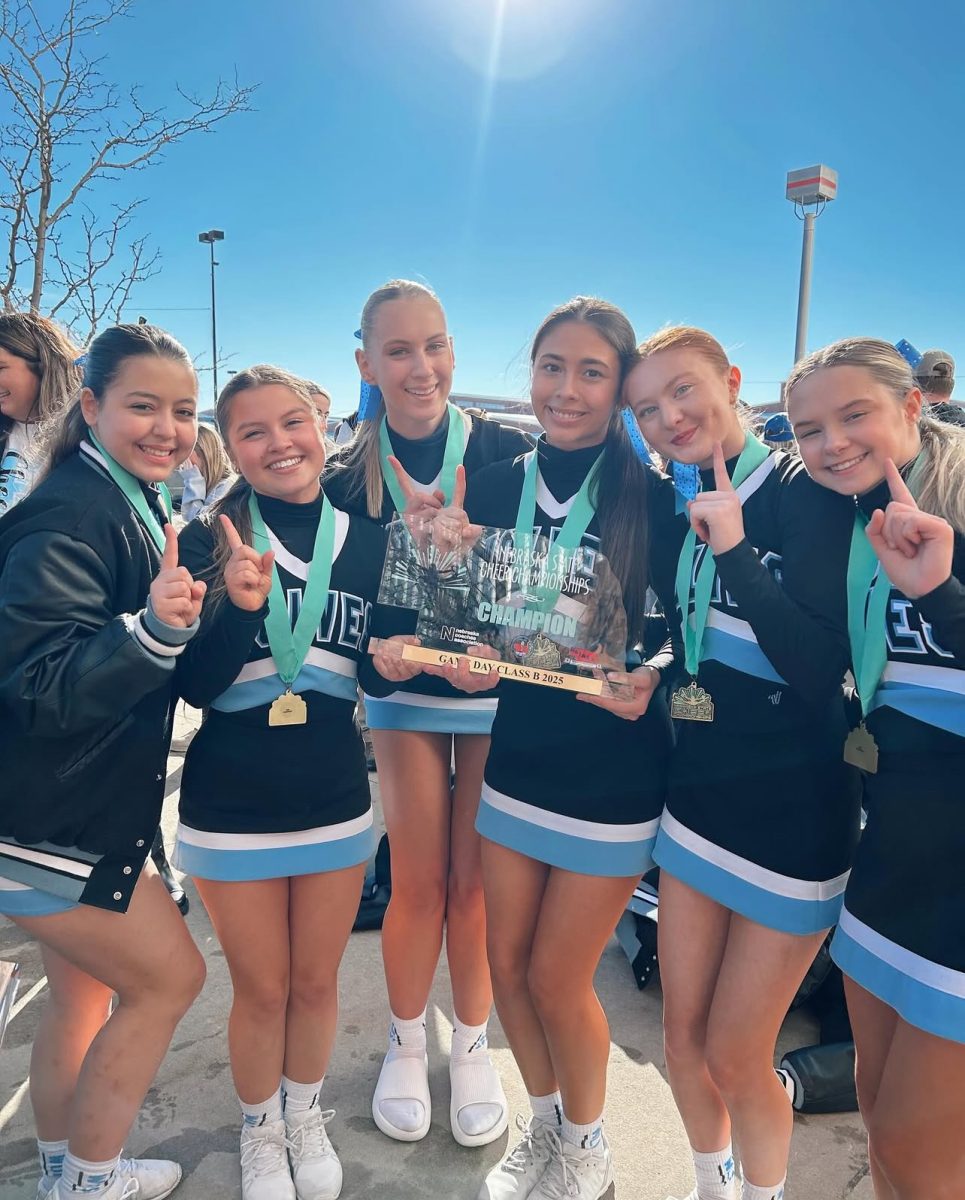 Senior cheerleaders pose for a picture after winning the state title in Grand Island, Nebraska.. This was their last time competing and they ended up winning it all to end their high school careers. Photo courtesy of Reyne Armbrust