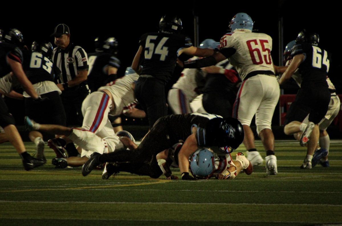 Senior offensive linebacker Shane Heida tackles a Ralston player. Heida had 3 pancake blocks against the Rams.