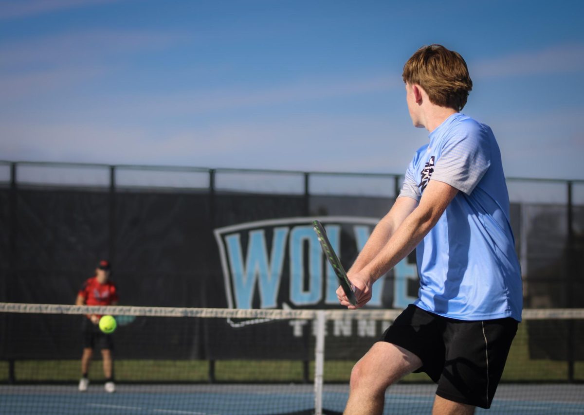 #2 singles senior Dallin McCune prepares a backhand groundstroke. He was down 3-4.