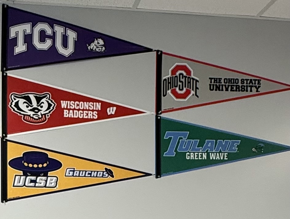 College pennants are displayed down the 200-level hall way. 