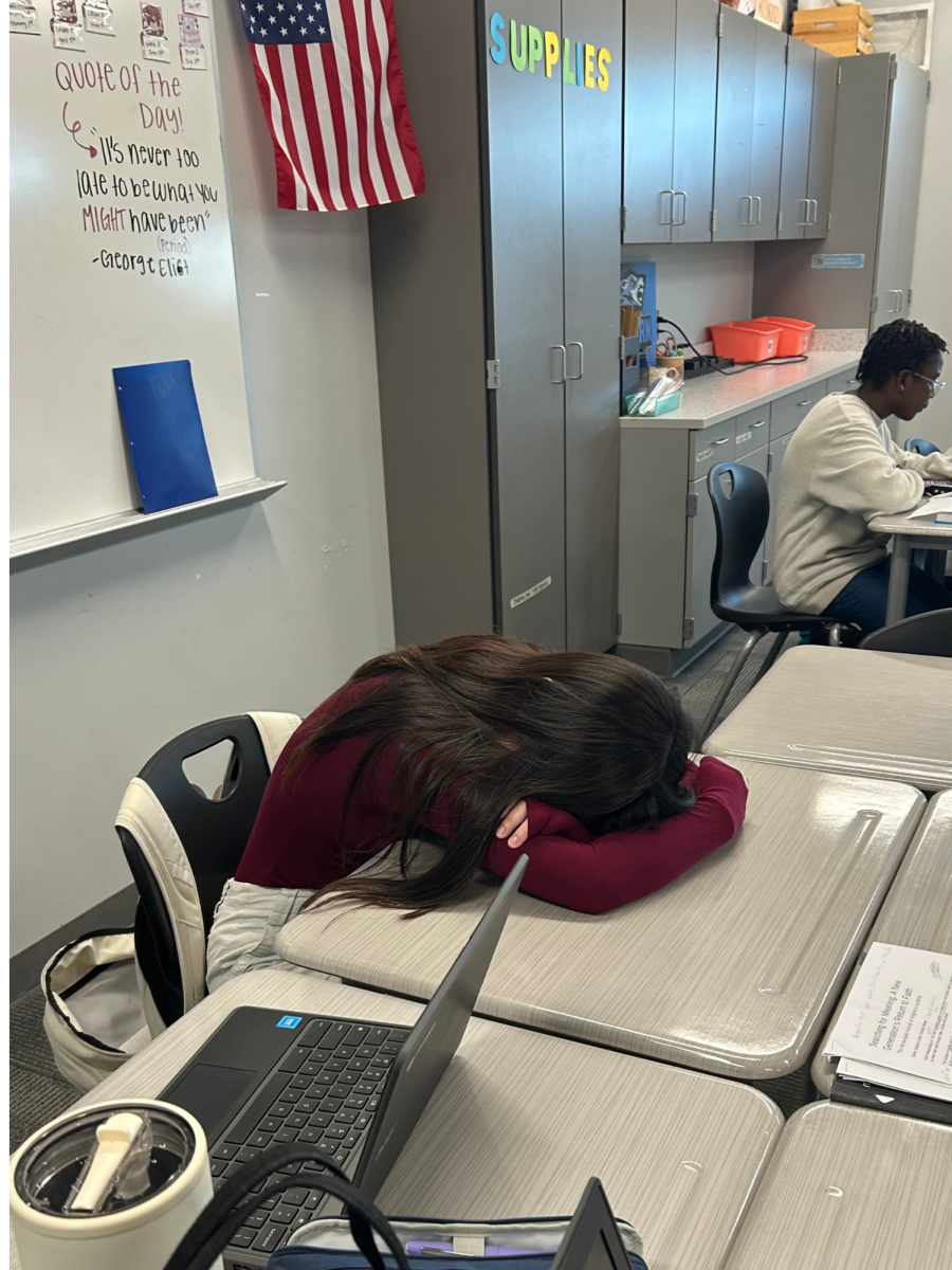 Student Abigail Kwon lays on her desk due to exhaustion. She is in many extracurriculars and has little to no time to relax. 