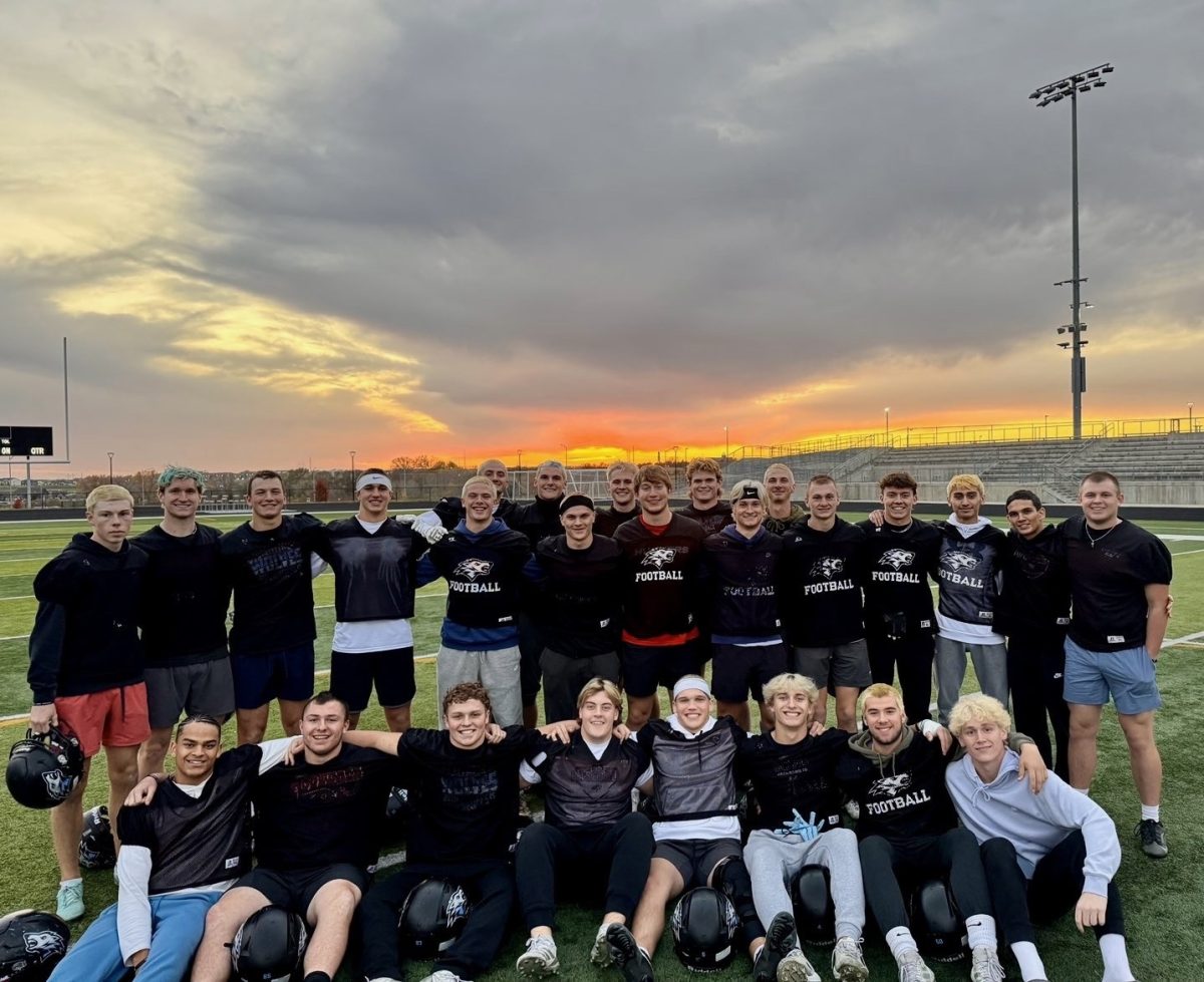 Seniors and others gather together on the final practice to take one last photo on the practice field. 
Photo Courtesy of Seth Krivohlavek