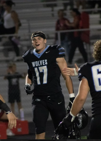 Barry Fries on the sideline after a stop against Elkhorn High. Fries then lead the Wolves to a 51-7 victory over the Antlers.