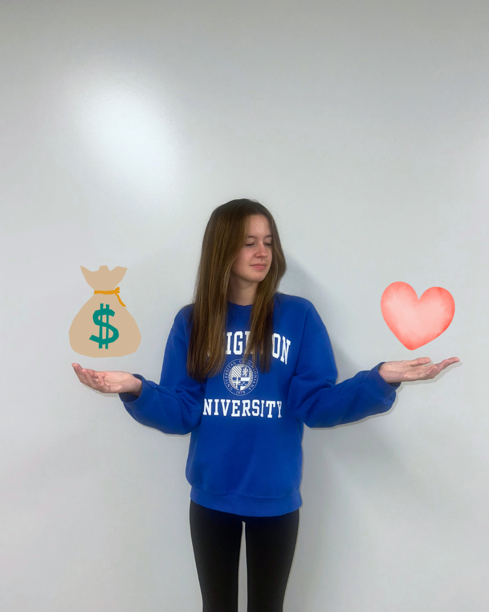 Elkhorn North student Emmie Ashby decides between a bag of cash and her heart. The decision is a tough choice as both are prominent to her. Graphic by Abby Kwon