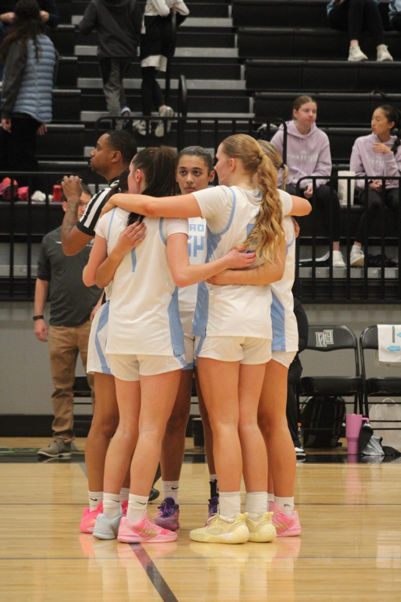 Elkhorn North girls huddle before the game starts. They had a great warm up and got ready to play the Badgers. 