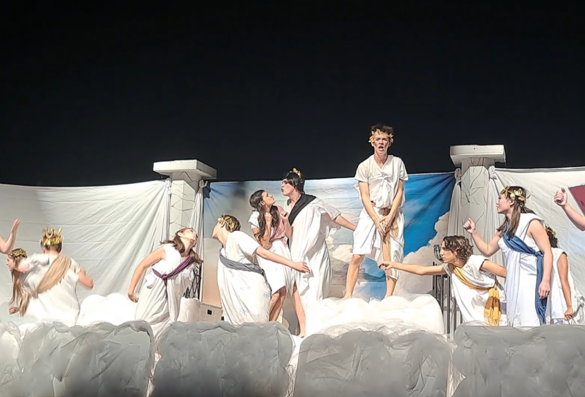 Zen Wesselmann delivers his final monologue of the play, while all cast acts it out ending with a bang. This was the last time One-act would perform at Districts November 26, at Elkhorn high. They are reenacting the Trojan war and the chaotic and somewhat true story of how it went down. Photo courtesy of Kyler Hilts.