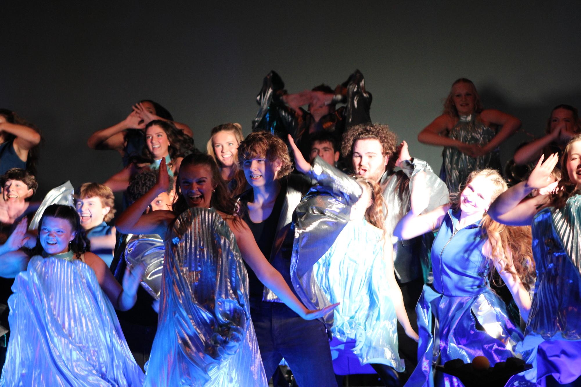 Adrenaline dances after their costume change. The change represents the "rainfall" after a severe drought. 