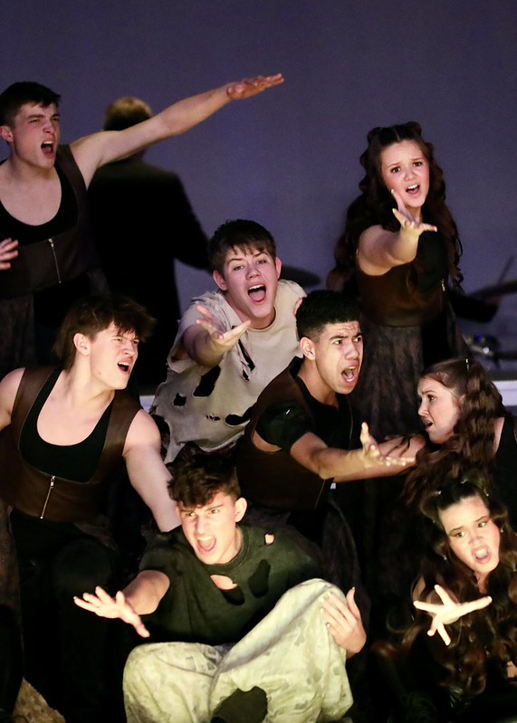 Will Swaggler (middle) during the opening sequence of adrENaline's 25-26 show. Courtesy of David Buck