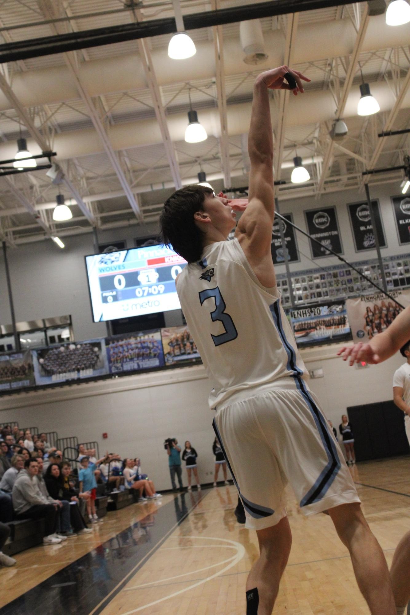 Junior Carter Peterson (3) goes to shoot a three pointer. Peterson attempted to score the wolves their first point.