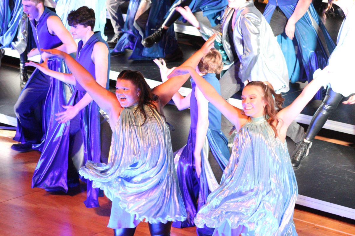 Seniors Kylie Marler and Audra Brabec dancing through their song "Its Like Rain". They stayed in the front 2 rows for most of the show. 