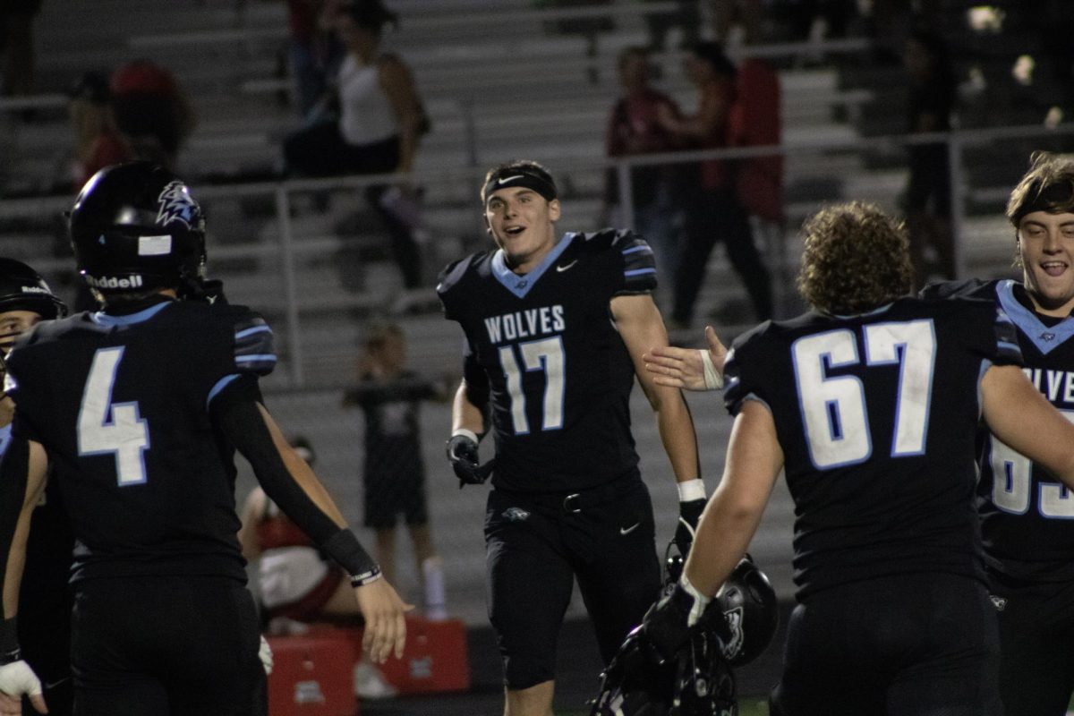 Barry Fries on the sideline after a stop against Elkhorn High. Fries then lead the Wolves to a 51-7 victory over the Antlers.