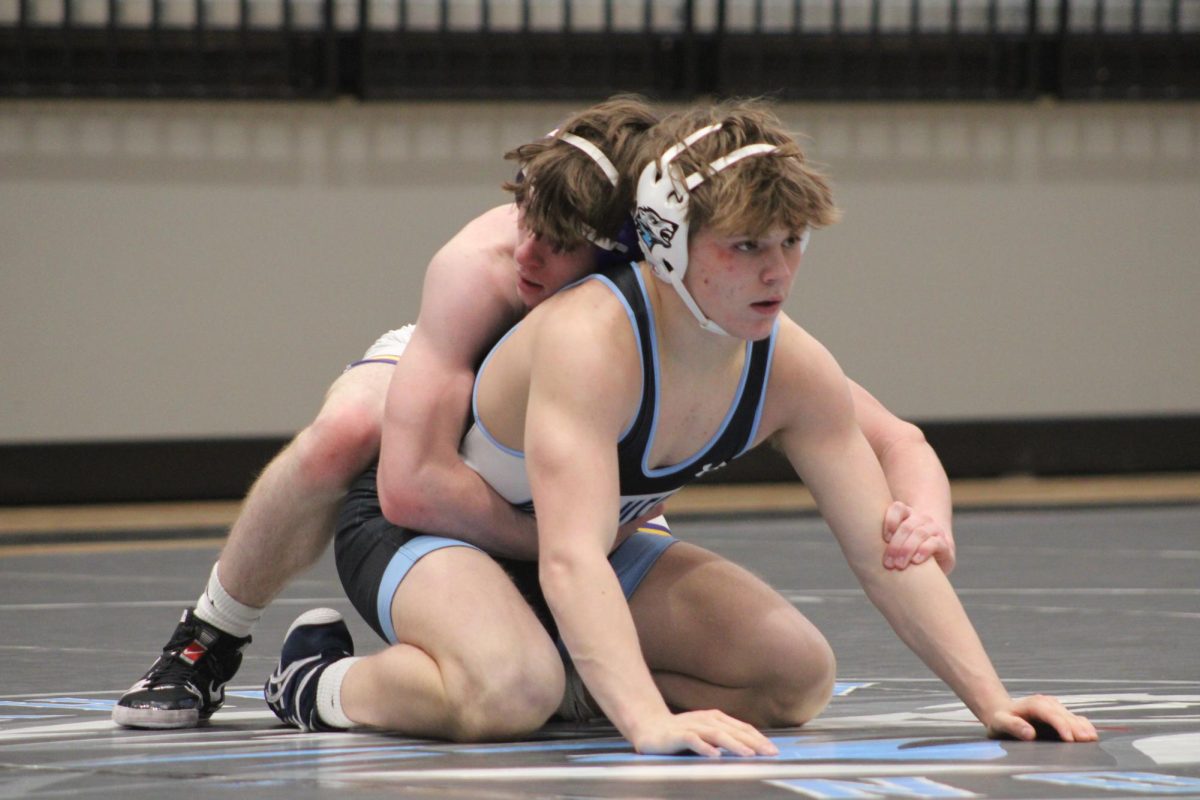 Ferguson competes against another wrestler. He had broken his record a couple matches before. Photo by Josie Kenny