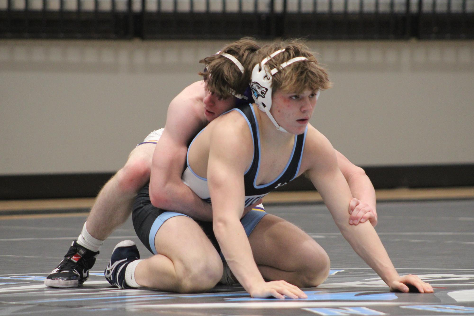 Ferguson competes against another wrestler. He had broken his record a couple matches before. Photo by Josie Kenny