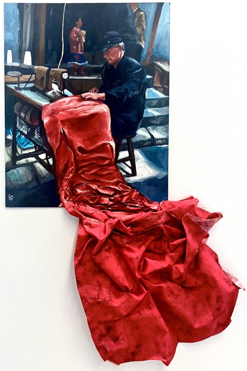 Zhang's award winning piece, a photo of her grandfather, who is a tailor. The fabric starts as a painting and then trails off the board to become 3-dimensional. Photo Courtesy of Erica Zhang
