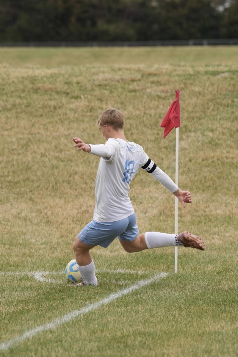 Senior midfielder Jack Olson getting ready to kick the corner kick, hoping his team puts it in the back of the net. 
Photo courtesy of Renee Vokt